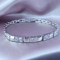 Baguette Stone Tennis Bracelet in Polished Silver Plate