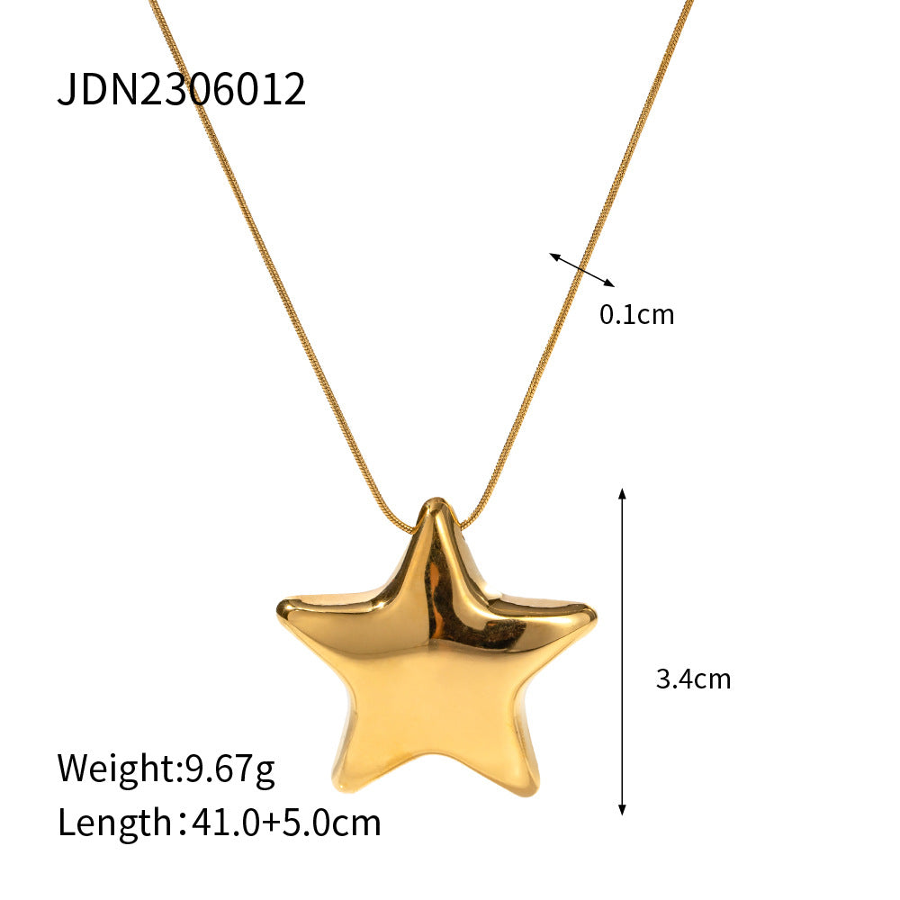 Gold star-shaped pendant necklace with measurements on a white background