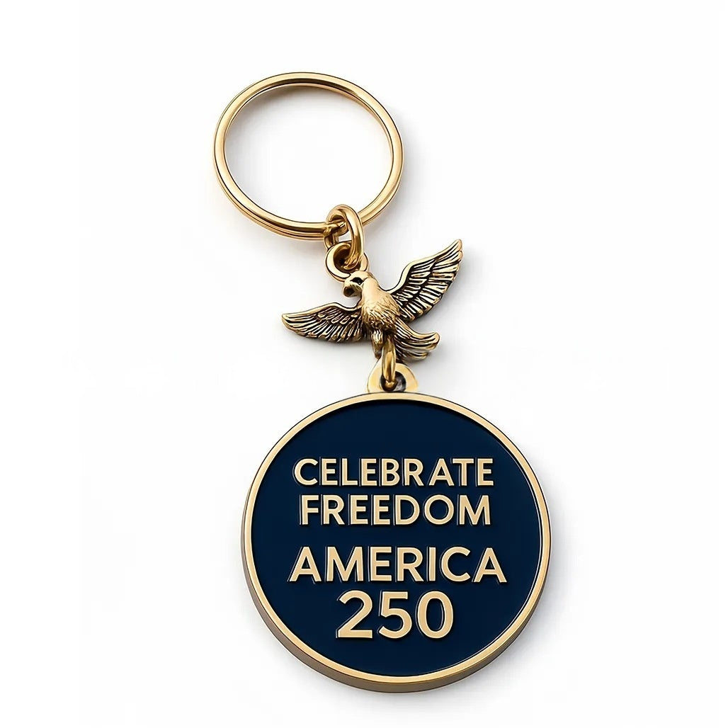 Keychain with eagle charm and 'Celebrate Freedom America 250' text on a white background