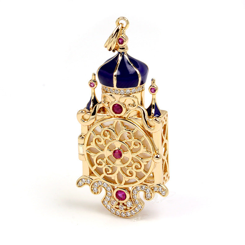 Decorative gold and blue pendant with gemstones on a white background