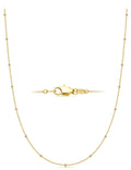 Gold necklace with a clasp on a white background