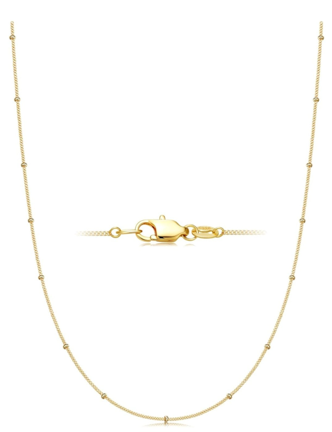 Gold necklace with a clasp on a white background