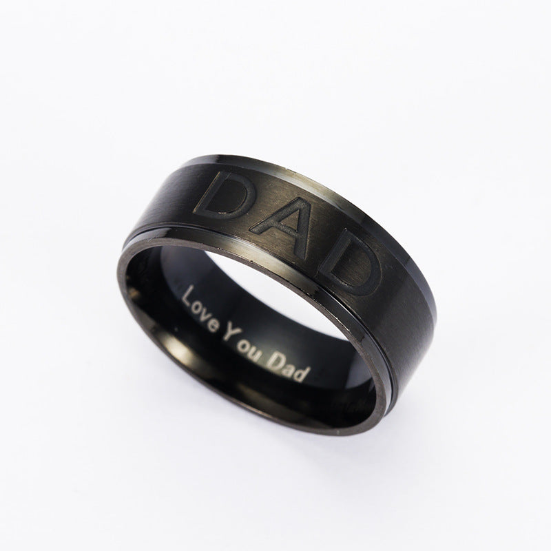Black ring with 'DAD' and 'Love You Dad' engraving on a white background
