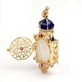 Decorative jewelry box with gold, blue, and red accents on a white background