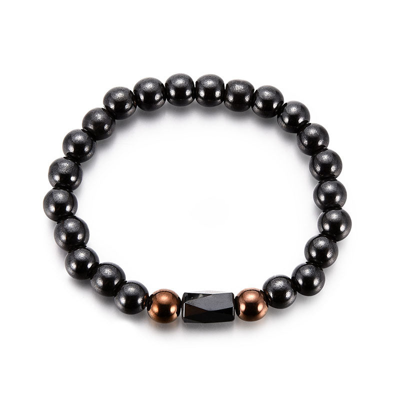 Black beaded bracelet with brown and rose gold accents on a white background