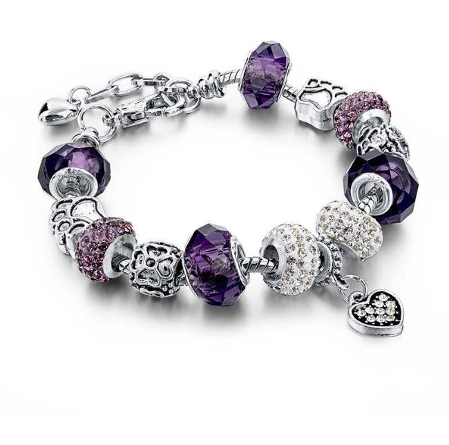 Bracelet with purple and clear beads on a white background