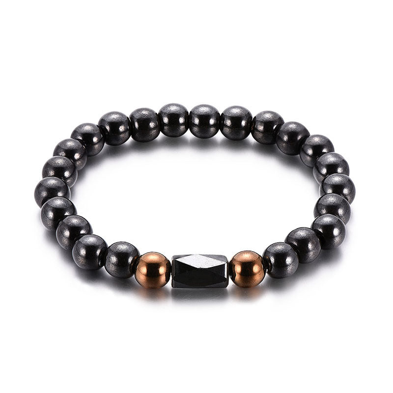 Black beaded bracelet with bronze and silver accents on a white background