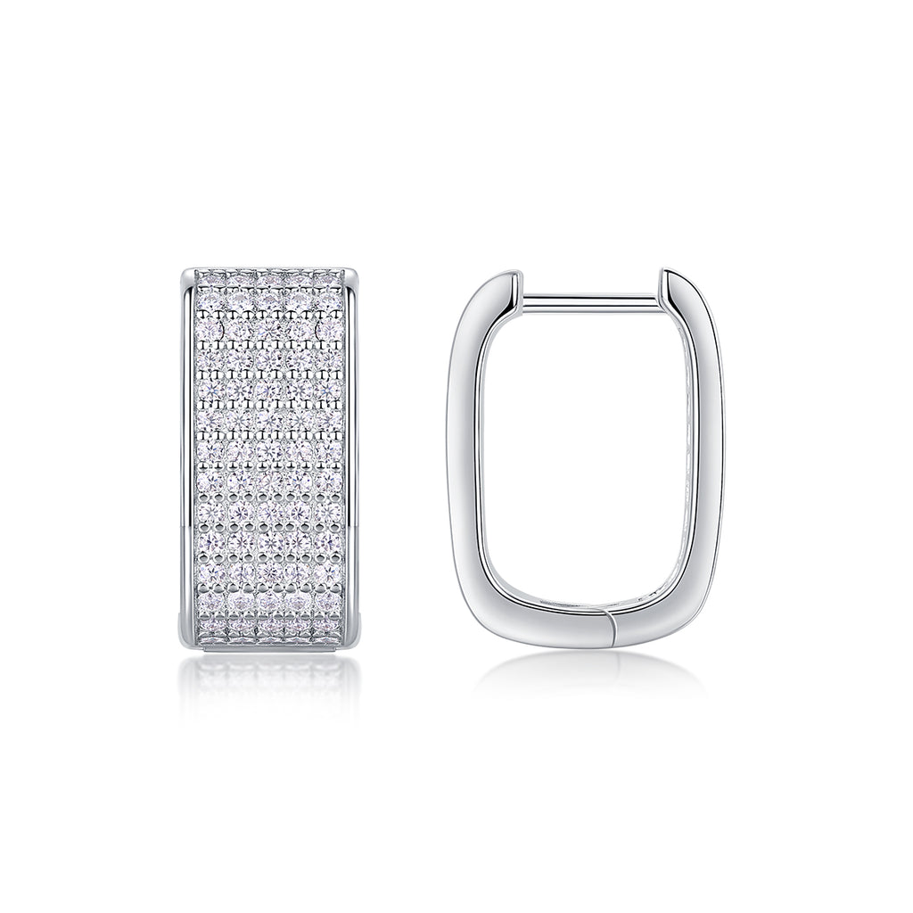 Silver hoop earring with embedded diamonds on a white background