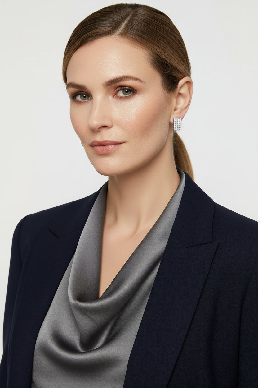 Pair of diamond earrings on a white background