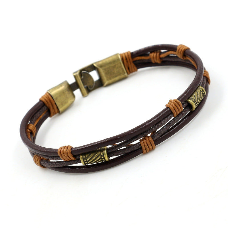 Brown leather bracelet with bronze clasp on a white background